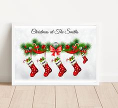 a christmas card with stockings and stockings hanging from the tree on it's side