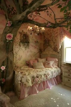 a bedroom decorated in pink and white with flowers on the walls