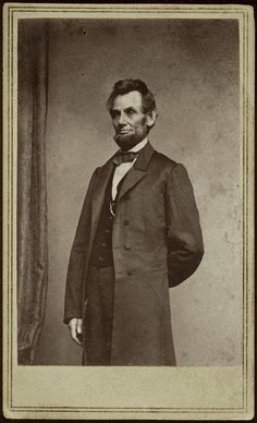 an old black and white photo of a man in a suit