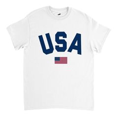 "Premium heavy cotton classic fit T-shirt with a great and letter graphic (\"USA\") and the flag of the United States of America on the front. Comfortable shirt for both men and women. Relaxed and regular fit. This versatile shirt is perfect for various occasions, whether you're attending a 4th of July celebration, supporting your favorite sports team or simply wanting to exhibit your love for the USA. Very nice gift idea for people whose heart truly lies for the USA - the land of the free and the home of the brave! Designed with ❤️ in California (USA)/England (UK) and produced fairly. Fabric details .: Heavy fabric (5.3 oz/yd² (180 g/m .: Solid colors are 100% cotton .: Seamless double-needle collar .: Double-needle sleeve and bottom hems .: 100% combed and ring-spun cotton .: Taped neck White T-shirt With American Flag For Independence Day, White American Flag T-shirt For Independence Day, Cotton Sports T-shirt With Flag Print, American Style Pre-shrunk Cotton T-shirt, Flag Print Crew Neck Tops For Sports Events, White T-shirt With American Flag, Cotton Crew Neck T-shirt With Flag Print, White T-shirt Made In Usa For Memorial Day, Made In Usa Crew Neck T-shirt For Veterans Day