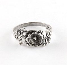 This pretty vintage style ring depicts a vine of pretty flowers and is made of Sterling Silver. The band measures 8mm at its widest point. Handmade to order. Vintage Wedding Toe Ring With Flower Design, Vintage Wedding Flower Toe Ring, Vintage Flower Toe Ring, Vintage Flower Toe Ring As Gift, Vintage Flower Engraved Ring For Anniversary, Vintage Flower Toe Ring Gift, Vintage Flower Toe Ring For Gift, Vintage Flower Shaped Ring As Gift, Vintage Flower Promise Ring