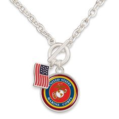 a silver necklace with an american flag and marine seal on the front, hanging from a chain