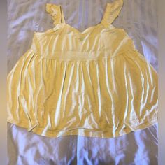 This Is A Nwot Torrid Baby Doll Summer Tank In Pretty Yellow! Cotton Stretch Ruffle Tank Top, Cotton Stretch Tank Top With Ruffles, Stretch Cotton Tank Top With Ruffles, Casual Cotton Top With Ruffled Straps, Casual Cotton Tops With Ruffled Straps, Cute Ruffled Solid Color Tops, Cotton Tops With Ruffled Hem And Straps, Cotton Tops With Ruffle Hem And Ruffled Straps, Cute Solid Tops With Ruffles