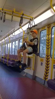 a man is sitting on a train seat