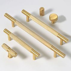 an assortment of brass handles and knobs