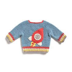 a knitted sweater with a rocket ship on it