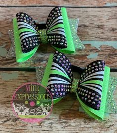 PLEASE READ ENTIRE DESCRIPTION BEFORE PURCHASE ►For our current shipping schedule please click here: https://www.etsy.com/shop/MiniExpressions/policy?ref=shopinfo_policies_leftnav You may also look in the Shipping & Policies tab above. Set of 2 TINY dolly cheer bows. Made with high quality rhinestones.  Can be made in custom colors. 2x4 inches each Will ship in a small box to insure that is doesn't get smashed in the mail. Combined shipping available. Orders over 10 receive a discount of 10% off Cheer Competition Hair, Competition Bows, Allstar Cheerleading, Cheer Hair Bows, Glitter Cheer Bow, School Cheer, Competition Hair, Pineapple Birthday, Fun Buns