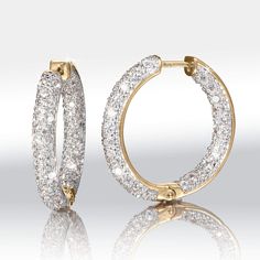 Wearable works of art. Sterling silver finished in opulent yellow gold. Prepare to be spellbound by the dazzle of these hoops. They are meticulously adorned with Diamondeau®, flawless simulated diamond, both inside and out, ensuring that they sparkle from every angle. With each movement, they catch the light and create a breath-taking display of radiance. These earrings make a wonderful gift for a loved one or a well – deserved treat for yourself. Luxury Hoop Earrings With Pave Setting, Luxury Pave Set Hoop Earrings, Luxury Small Hoop Earrings With Pave Setting, Hoop Earrings With Pave Setting In Cubic Zirconia, Cubic Zirconia Hoop Earrings With Pave Setting, Dazzling Gold Hoop Earrings, Sparkling Diamond Hoop Earrings As Gift, Sparkling Diamond Hoop Earrings For Gift, Fine Jewelry Cubic Zirconia Hoop Earrings With Halo Design