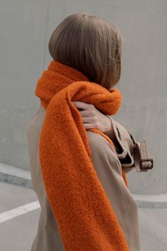 Wrap yourself in warmth and softness of this blanket scarf! It is knitted from alpaca blend boucle yarn, which is silky soft on the skin and drapes beautifully.  Available in 9 colors: bright orange, natural white, hazelnut brown, brown mélange, beige mélange, black mélange, dark gray mélange, light gray mélange and light blue mélange.  There's one scarf in each color available except bright orange and black mélange ready to ship in 2-3 days! When buying two or more items from the shop 10% discount is applied on the order (except for the knitted sets, where the discount already is included). Please drop a message for a coupon code if you're planning purchasing multiple items. The scarf is knitted on hand-operated knitting machine in small studio in Valmiera, Latvia. For more pictures and s Orange Fashion Outfits, Small Scarf Outfit, Black And Orange Outfit, Orange Scarf Outfit, Scarf Aesthetic, Scarf Photography, Color Terracota, Woolen Scarves, Orange Scarf