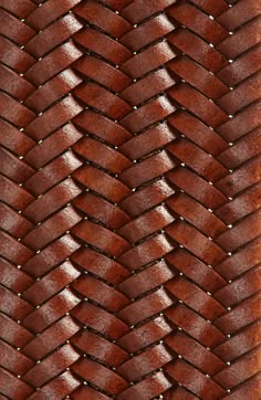 a close up view of a woven leather material