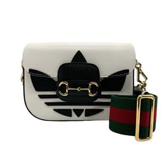 Gucci Shoulder Bag X Adidas Leather White Length: 15cm X Width: 16cm X Depth: 5cm Shoulder: 106cm Gucci Leather Shoulder Bag With Logo Strap, Gucci Designer Bag With Logo Strap, Gucci Luxury Bag With Logo Strap, Designer Gucci Bag With Logo Strap, Luxury Gucci Bag With Logo Strap, Gucci Rectangular Bag With Logo Strap, Modern Gucci Shoulder Bag With Logo, Formal White Shoulder Bag With Logo, Black Gucci Shoulder Bag With Logo