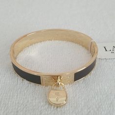 New...Not Used...Authentic 7.50" Bangle Bracelet Brown (Color, Leather) Gold Tone Brass Base (Metal) Polished Finish Padlock With Lrl Logo .47" Wide Hinge Closure Ralph Lauren Jewelry, Girls Best Friend, Base Metal, Brown Gold, Bangle Bracelet, Womens Jewelry Bracelets, Brown Color, Bangle Bracelets, Gold Tones