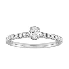 Make a proposal special and memorable with this diamond oval shape solitaire style ring created in 10K White Gold. Crafted in a shiny finish, this ring contains an oval shape diamond in the center and is complemented with small round diamonds cascading down both sides. This diamond ring contains a total of 21 diamonds and has a total carat weight of 1/2 cttw. The diamonds are securely set in a prong setting. Perfect for engagements. Ladies diamond rings. Engagement rings. Solitaire rings. Foreve Timeless Oval Diamond Anniversary Ring, Oval Diamond Ring For Anniversary, Diamond White Oval Solitaire Ring, Oval Solitaire Diamond Ring Fine Jewelry, Oval Diamond Ring With Center Stone, Oval Diamond Promise Ring In Fine Jewelry Style, Oval Diamond Ring With Center Stone For Anniversary, Classic Oval Ring With Diamond Accents, Classic Ring With Diamond Accents And Oval Shape