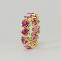 {WELCOME TO MY SMALL WORLD OF ART} JEWELRY TYPE - HEART ETERNITY RING METAL: . Metal - 925 Sterling Silver  . Metal color - White Rhodium Plated/ Rose Plating / Yellow Plating Gemstone Details: . Gemstone Name - Lab Pink Sapphire . Gemstone Size - 5mm . Gemstone Shape - Heart  Custom design order is welcome here. We can also make it fast on custom request of customer express delivery through Fed-Ex DHL Express This design belongs to Shannon Jewels all rights are booked by us We are 100% responsi Pink Eternity Band Ring As Gift, Pink Eternity Band With Prong Setting As Gift, Pink Stackable Eternity Band As Gift, Pink Cubic Zirconia Eternity Band As Gift, Pink Round Band Eternity Ring As Gift, Pink Round Band Eternity Band As Gift, Pink Round Eternity Band As Gift, Pink Jewerly, Pink Heart Ring