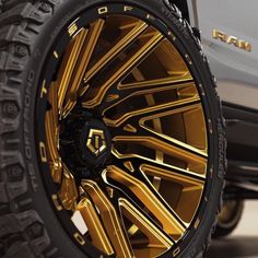 the gold wheels and tires of a truck