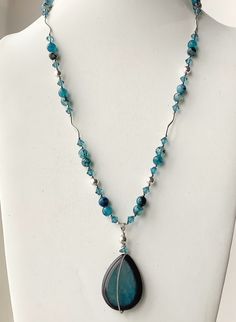 The colors of this necklace are the most beautiful shades of teal and aqua! The beads vary in intensity from a very light blue to a dark teal. The tear drop pendant has a very simple sterling silver wire wrap. I added 6mm Bicone aqua zircon Swarovski crystals for a touch of sparkle against the opaque stones. The round 7mm sterling silver beads and curved tube beads add elegance and movement to the design. This necklace will be perfect with neutrals, black, aqua ir print dresses or tunics. The be Latest Simple Necklace Designs, Elegant Pearl Jewelry, Tear Drop Pendant, Swarovski Crystal Jewelry, Necklace Ideas, Crystal Bead Necklace, Crystal Necklaces, Swarovski Crystal Necklace, Sterling Silver Wire Wrap