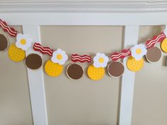 a decorated garland with pineapples, bacon, eggs and other things on it