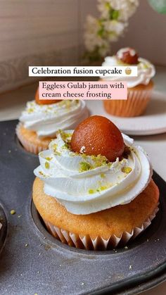 cupcakes with cream cheese frosting and an orange on top