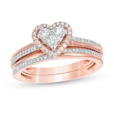 She'll adore the romantic look of this blissful diamond bridal set. Crafted in precious 10K rose gold, the sentimental engagement ring showcases a heart-shaped composite of diamonds - the largest three being 1/20 ct. each - wrapped in an open diamond-lined frame. The double-row shank glistens with a clever arrangement of diamond-lined and polished ribbons. Completing her ensemble, the coordinating wedding ring features a complementing diamond-touched design. Captivating with 1/2 ct. t.w. of diam Heart Shape Rings Engagement Gold, Rose Gold Heart Engagement Ring, Rose Gold Heart Cut Jewelry For Proposal, Rose Gold Heart Cut Ring For Wedding, Wedding Heart Cut Rose Gold Heart Ring, Rose Gold Wedding Jewelry For Valentine's Day, Valentine's Day Rose Gold Wedding Jewelry, Wedding Ring Sets Rose Gold, Renew Vows