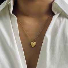 Elevate your style with our exquisite Heart Shape Vintage Charm Necklace. This stunning piece features a delicate heart-shaped vintage charm meticulously crafted and plated with lustrous 14K gold. Suspended from a dainty chain, this necklace exudes elegance and sophistication. Perfect for any occasion, our Heart Shape Vintage Charm Necklace adds a touch of nostalgic allure to your look, making it a truly timeless and versatile accessory. Embrace the elegance of the past with a contemporary twist Vintage Heart-shaped Necklace For Gift, Elegant Heart-shaped Vintage Charm Necklace, Heart-shaped Vintage Charm Necklaces, Vintage Heart-shaped Metal Charm Necklace, Antique Heart-shaped Necklace With Vintage Charm, Heart Lock, Vintage Charms, Vintage Necklace, Charm Necklace