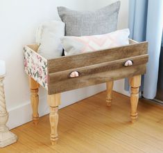 a wooden bench with some pillows on it