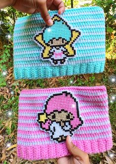 two crocheted purses that have been made to look like cartoon characters