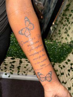 a woman's arm with a butterfly tattoo on it and the words grandma's love