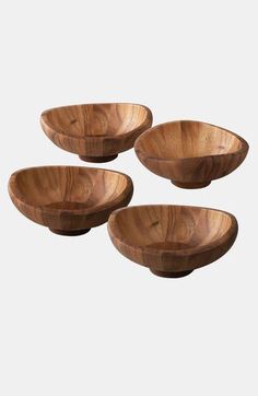 three wooden bowls sitting on top of each other