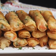 there are several rolls on the plate with parsley