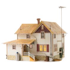 a doll house with a porch and stairs to the second floor is shown on a white background