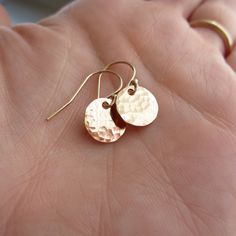 These simple disc earrings are perfect for everyday wear! Hand hammered finish Choose from: ~sterling silver ~14K yellow gold filled ~14K rose gold filled Discs measure 9mm in diameter. >>To enter to my shop<< http://www.kgarnerdesigns.etsy.com Please contact me PRIOR TO PURCHASE if you are ordering on a deadline. I can usually accommodate quick shipping if I am made aware of your deadline. *Expedited shipping is available during checkout.* Most items are ready to ship 2 business day Secret Message Jewelry, Small Gold Earrings, Silver Earrings Simple, Small Earrings Gold, Silver Gold Earrings, Dot Earrings, Bridesmaid Earrings Gold, Gold Dot, Brass Hoops