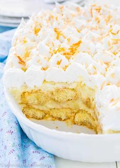 a close up of a cake in a pan on top of a table with a blue and white cloth