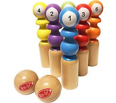 an assortment of colorful wooden balls and numbers on top of each other in front of a white background