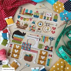 sewing supplies are laid out on a table with measuring tape, scissors and other crafting items