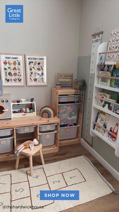 a child's playroom with toys and storage bins on the floor, along with bookshelves