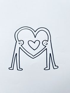 a drawing of two people holding hands with a heart in the middle on a piece of paper