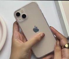 a person holding an iphone in their hand