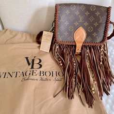 Brand New From Vintage Boho Bags, Louis Vuitton Up Cycled Monogram Canvas Cartouchiere Crossbody Bag -Flap Top And Buckle Closure -2 Separate Interior Compartments -Holds A Lot -Measurements Are Approximately: 7” L X 8 1/2” W X 2 1/2”D -Dirty Blonde Fringe -Braided Leather Strap -Rare Find As It Is No Longer On Their Site -Brand New From Vintage Boho Bags, Tag Still On It -Pet And Smoke Free Home Louis Vuitton Western Purse, Blonde Fringe, Boho Crossbody Bag, Western Purses, Bags Louis Vuitton, Boho Bags, Dirty Blonde, Braided Leather, Vintage Boho