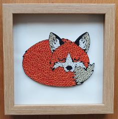 an image of a red fox in a frame