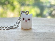 This white cat glass beads necklace is cute and dainty, which are perfect gifts for kids and friends.  They are made of the following: 🔹 Handmade glass beads: H13 x W10 x D12mm (0.5-1mm variation).  Each bead is unique so there is a slightly different from bead to bead. 🔹 Necklace chain: gold / silver plated over brass 🔹 Necklace Length: choose the exact length of the chain (the length includes clasp and findings).   【PLEASE NOTE THE FOLLOWINGS BEFORE PURCHASE】 ✔ VAT, GST and any other taxes Whimsical White Necklaces For Gifts, Whimsical White Necklace For Gift, Whimsical White Necklace Perfect For Gifts, Cute White Nickel Free Necklaces, Cute White Nickel-free Necklaces, Handmade White Kawaii Necklace, Kawaii White Jewelry For Gifts, Adjustable White Cat Design Jewelry, Adjustable White Jewelry With Cat Design