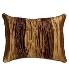 a brown and gold pillow on a white background