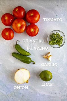 tomatoes, onions, peppers, and other ingredients are arranged on a sheet of paper