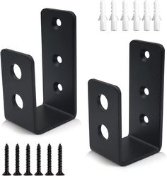 two black metal brackets with screws and white plastic caps on the top one has four holes in it