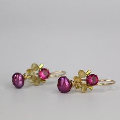 These handcrafted dancer earrings are petite, delicate and whimsical. The unique copper bezel setting showcases a bright pink corundum zircon. Beautiful and elegant citrine gemstones are hand woven and a lovely pink pearl dangles gently. These romantic and colorful dancer earrings seem to come straight from a fairytale!They're the perfect pair of earrings to give your special someone! The hook is made of gold filled. The earring's hook can be made with sterling silver or solid gold incase of all Unique Pink Jewelry For Celebration, Pink Briolette Earrings As Gift, Pink Briolette Earrings For Gift, Pink Briolette Earrings For Pierced Ears, Festive Pink Ruby Earrings, Pink Birthstone Drop Earrings, Fine Jewelry Gemstone Flower Earrings, Fine Jewelry Gemstone Flower Earrings As Gift, Fine Jewelry Flower Earrings With Gemstones For Gift