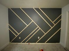 an empty room with some tape on the wall