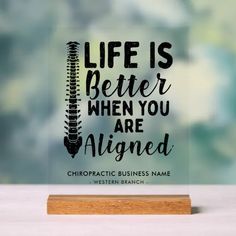 a glass plaque that says life is better when you are aligned