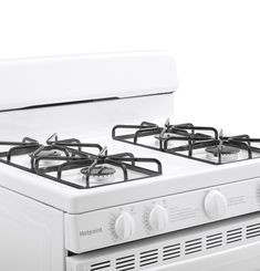 a white stove top oven with two burners on it's front and side