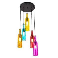 multi - colored glass bottles are hanging from the ceiling and one light is turned on