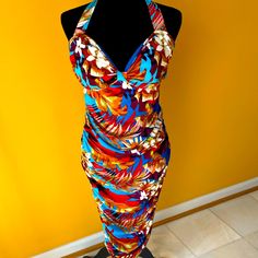 Brand New, Great Condition, Floral Halter Dress With Neck Tie Closure And Partial Back Out Detail, Back Zipper Closure, Side Ruching And Very Comfortable With Stretch Tropical Multicolor Midi Dress With Floral Print, Multicolor Floral Print Midi Beach Dress, Multicolor Floral Print Midi Dress For Beach, Tropical Multicolor Midi Dress With Vibrant Print, Multicolor Floral Print Beachwear Dress, Fitted Floral Print Midi Beachwear Dress, Fitted Tropical Print Beachwear Dresses, Fitted Tropical Print Dress For Beachwear, Fitted Multicolor Floral Dress For Beach