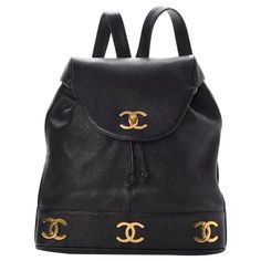 For Sale on 1stDibs - Chanel Vintage Caviar 1990s CC Drawstring Rucksack The backpack features gold Chanel CC logos along the bottom trim, gold hardware and two lengthy leather Chanel Book, Vintage Chanel Bag, Chanel Backpack, Unique Handbags, Vintage Chanel Handbags, Vintage Backpacks, Women Leather Backpack, Chanel Purse, Novelty Bags